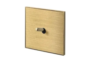 Lithoss Cockpit, 1 toggle, Opera vertical frame, 24V push button, Brushed Brass with knurl